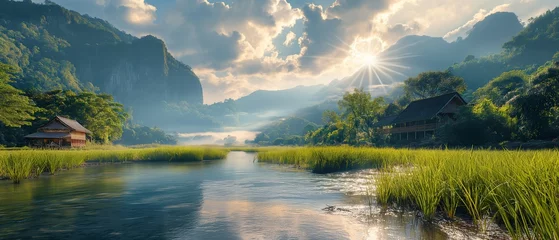 Tuinposter Majestic sunrise illuminates a tranquil river winding through lush mountains, showcasing the beauty of unspoiled nature in a breathtaking landscape © TEERAPONG