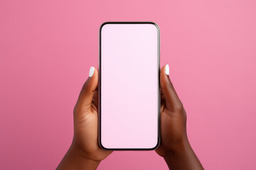 Person holding phone with pink background
