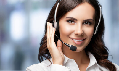 Call center service. Customer support phone sales operator wear headset, white cloth, against blurred modern office background with area for ad advertise slogan text. Advisor help line.