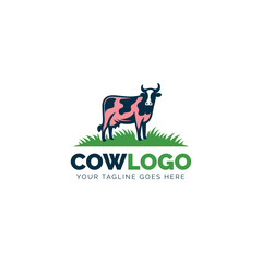 Animated cow standing in a green field logo