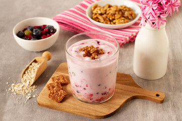 Healthy breakfast with oatmeal, yogurt, nuts and red fruits