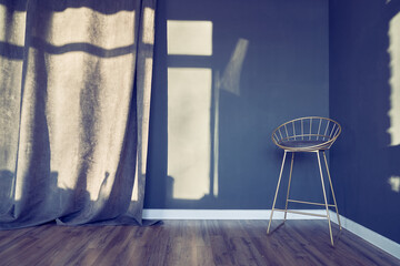 Dark blue room with modern chair on high legs, metal frame with soft seat, curtains, window shadow, brown wooden floor. Background with copy space, empty. Template, mock up for your design.