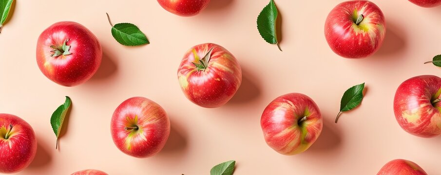 Creative pattern made of apple on beige background.