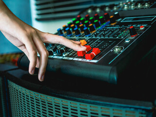 Sound engineer hands adjusting control sound mixer in recording, broadcasting studio,Sound mixer....