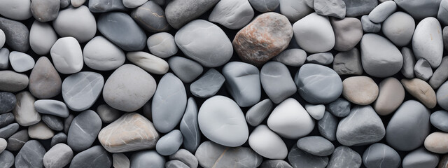 Fototapeta na wymiar Smooth Pebbles in Shades of Grey and White