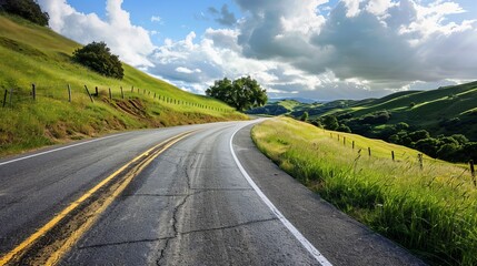 Naklejka premium An open road through rolling hills, inviting a summer road trip. 