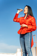 Latin singer during a rehearsal on the roof of the building