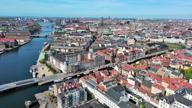 Copenhagen: Aerial view of capital city of Denmark, Nyhavn 17th-century waterfront, canal and entertainment district with iconic multicolored townhouses - landscape panorama of Europe from above
