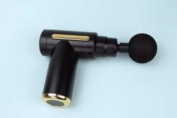 Portable Therapy Massage Gun. Percussion massager. Massager for muscle recovery after injury or intense activity.
