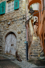 Uphill alley and stone staircase in the medieval town, called 