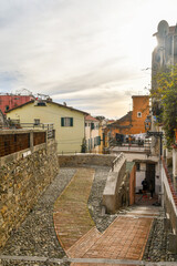 Glimpse of La Pigna district, the old town founded around the 11th century, with the typical uphill alleys at sunset, Sanremo, Imperia, Liguria, Italy