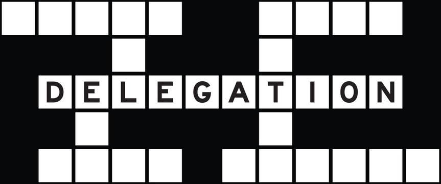 Alphabet letter in word delegation on crossword puzzle background