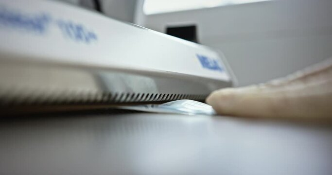 Nurse Vacuum Sealing Surgical Instrument in Lab