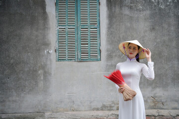Vietnamese woman in “Ao Dai” traditional dress of vietnam