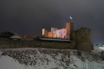 Night scene, ruins of Rakvere castle and cloudy sky.