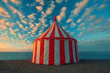 Red and White Striped Tent on Sandy Beach
