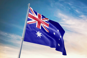 Fototapeta premium Waving flag of Australia in blue sky. Australia flag for independence day. The symbol of the state on wavy fabric.