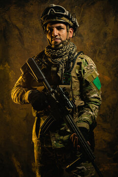 A portrait of a resolute Latin American soldier in full gear, posing with his rifle against a textured backdrop