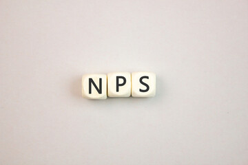 NPS net promoter score,abbreviation. NPS text,inscription on wooden cubes,business concept.
