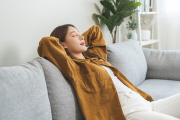 Relaxed serene, happy calm attractive asian young woman peace of mind, relaxing on comfortable...