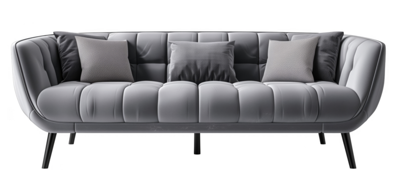 A gray couch with pillows on it. The couch is long and has a curved shape. The pillows are arranged in a way that makes the couch look inviting and comfortable