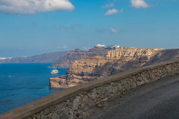 serpentine road in the mountains along the sea on the island of Santorini in Greece
