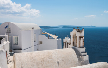 view of the church and the Aegean sea on the island of Santorini in Greece
