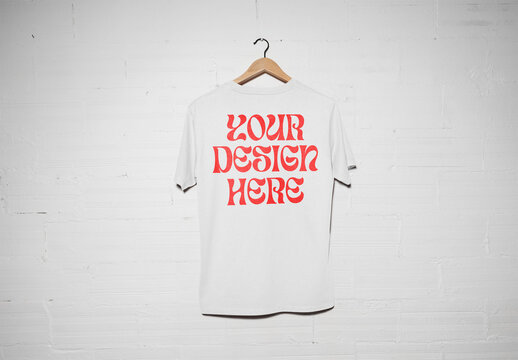 Mockup of customizable t-shirt on hanger, camera flash