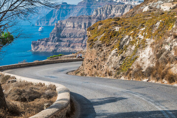 serpentine road in the mountains along the sea on the island of Santorini in Greece