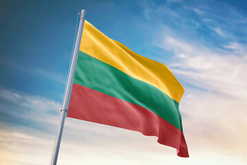 Waving flag of Lithuania in blue sky. Lithuania flag for independence day. The symbol of the state on wavy fabric.