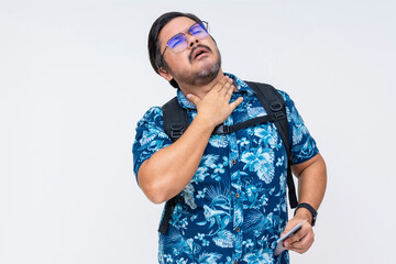 Middle-aged male tourist feeling thirsty, clutching his neck. Wearing a blue Hawaiian shirt, isolated on white background.