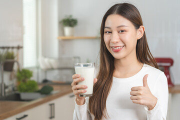 woman drinking milk - obrazy, fototapety, plakaty