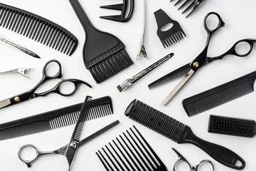 Wandcirkels aluminium Black hairdressing tools and various hairbrushes on white background © fotofabrika