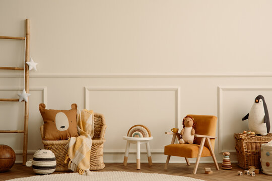 Warm and cozy kids room interior with orange armchair, white stool, round rug, braided armchair, plush toys, wooden blockers, beige wall with stucco and personal accessories. Home decor. Template.