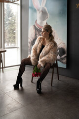 A girl in a bodysuit and a fur coat with flowers poses in different locations
