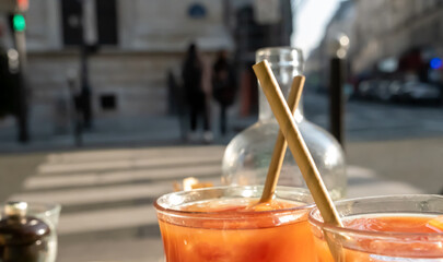 Orange Juice Glasses Paris street in the background