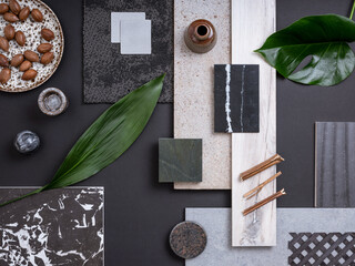 Classic flat lay composition in grey and navy color palette with  textile and paint samples, lamella panels, leaves and tiles. Architect and interior designer moodboard. Top view. Copy space.