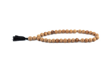 Wooden rosary for meditation or religious practice on a white background.