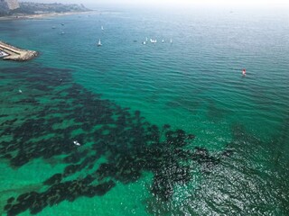 Yachting and SUP surfing on the Coast of Spain