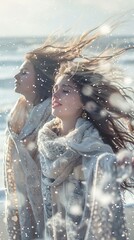 Young women feel winter wind on the beach