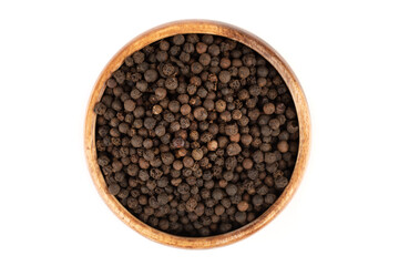 Top view of a wooden bowl full of black pepper peas.