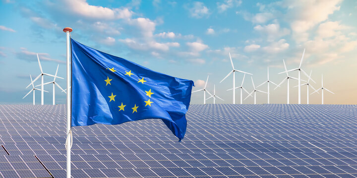 Official flag of the European Union in front of a large array of solar panels and wind turbines