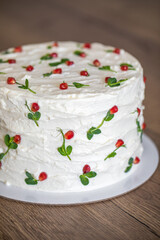 White homemade cake on a wooden table