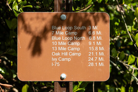 A sign at the southern terminus of the Cross Seminole Trail, Florida, with northbound mileage
