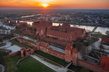 Malbork castle over the Nogat river at sunset, Poland - 761487308