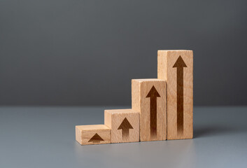 Growth chart made from wooden blocks. Growth and development, promotion. Career advancement....