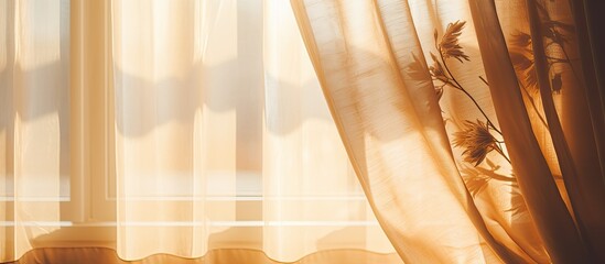 The suns rays are filtering through the patterned curtains, casting tints and shades on the wooden...