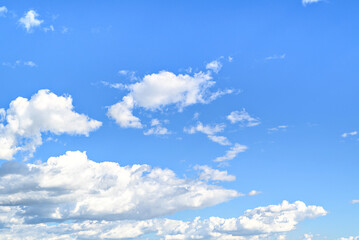 White clouds in a bright blue sky. The beauty of the nature