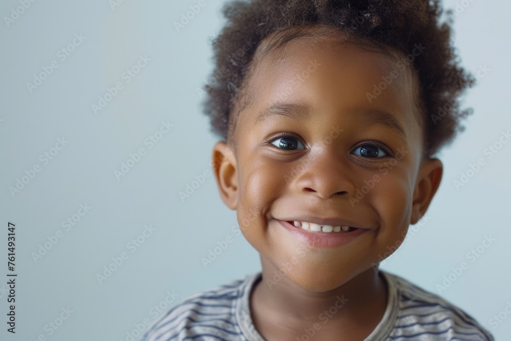 Poster a cheerful young boy with a big smile on his face. suitable for family, happiness, and childhood con