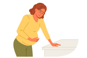 Pregnant woman holds stomach, standing near cabinet, experiencing pain due to complications caused by fetal development disorders. Pregnant girl needs hospitalization to avoid miscarriage
